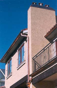 Completed copper chimney cap and collector box installation